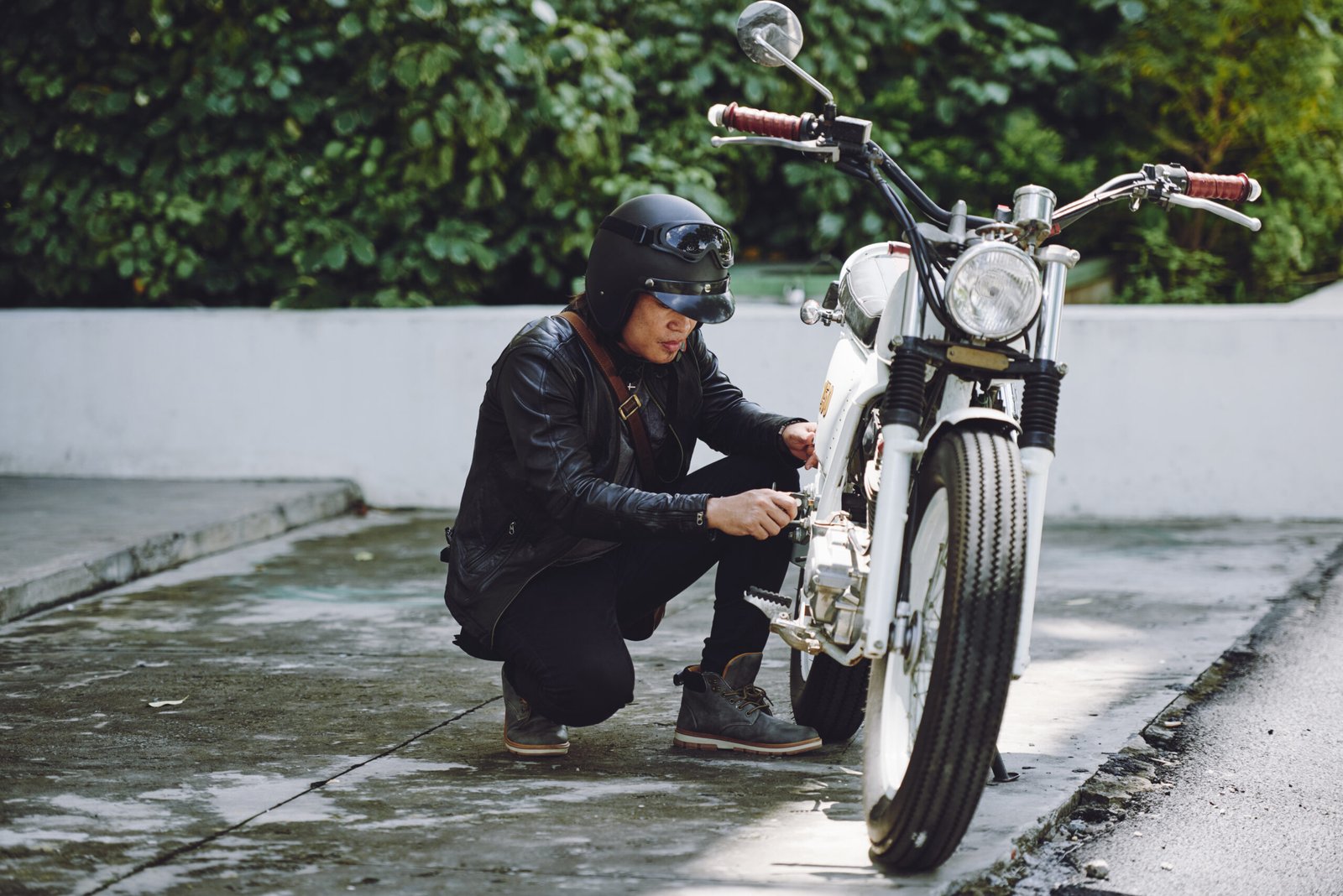 portrait motorcyclist preparing his vehicle ride scaled